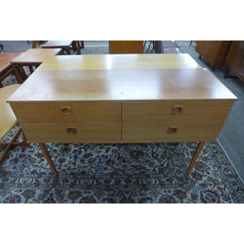 59 - A small teak four drawer sideboard