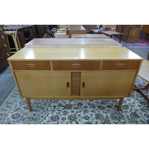 60 - A light oak sideboard