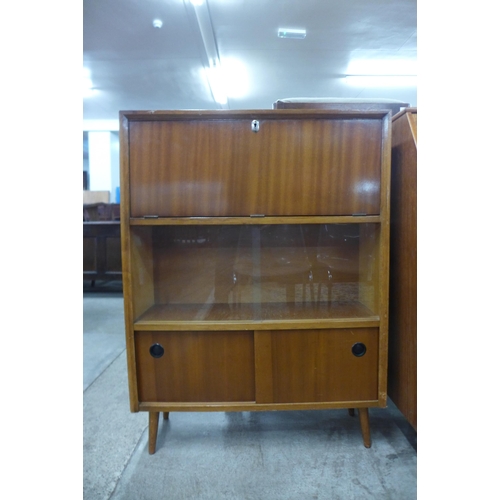 64 - A teak writing cabinet