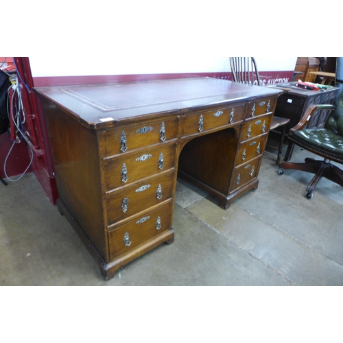 93 - A Victorian Gothic Revival oak and red leather topped desk, manner of A.W.N. Pugin