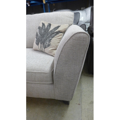 1353 - A beige textured weave three seater sofa - RRP £1099