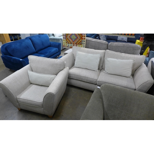 1354 - An oatmeal upholstered three seater sofa and armchair - RRP £1898