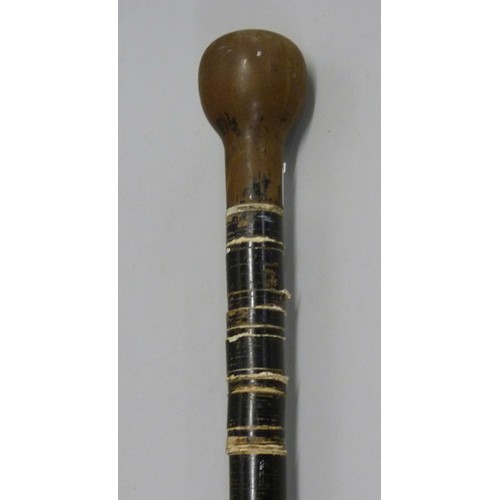 812 - A walking stick constructed from leather washers on a metal rod with screw top