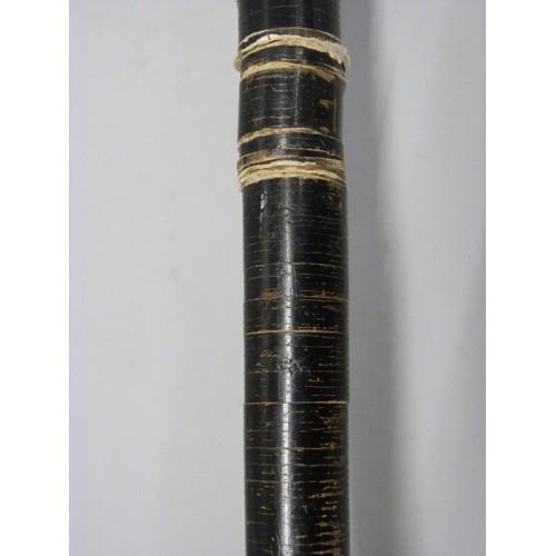 812 - A walking stick constructed from leather washers on a metal rod with screw top