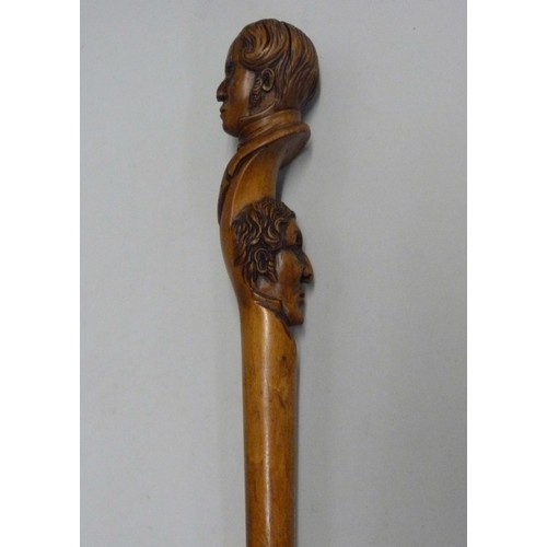 816 - A 19th Century carved fruitwood walking stick with two opposing carved heads, possibly French noblem... 