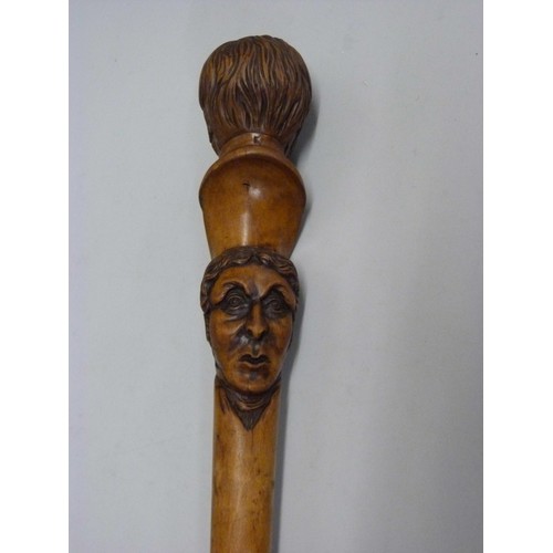 816 - A 19th Century carved fruitwood walking stick with two opposing carved heads, possibly French noblem... 