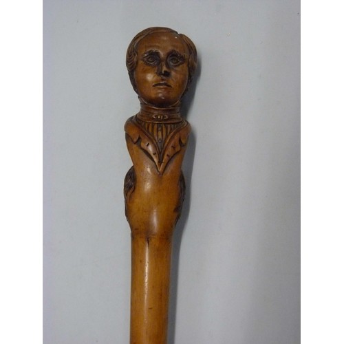 816 - A 19th Century carved fruitwood walking stick with two opposing carved heads, possibly French noblem... 