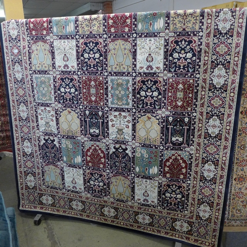 1542 - A blue ground carpet with Persian panel design, 300cm x 200cm
