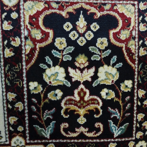 1542 - A blue ground carpet with Persian panel design, 300cm x 200cm