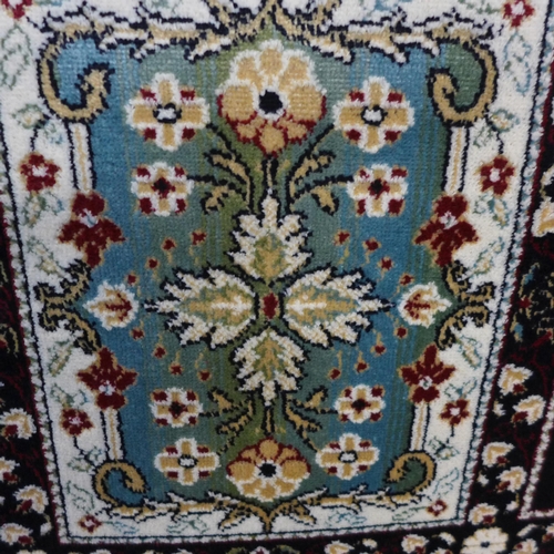 1542 - A blue ground carpet with Persian panel design, 300cm x 200cm