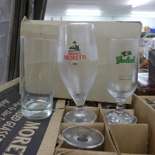 2129 - Approx. 30 pint and half pint bar glasses, many branded: Grolsch, Birra Moretti, etc.