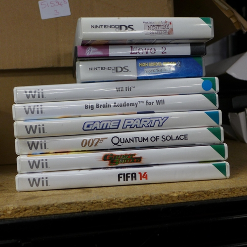 2169 - Two Nintendo Wii consoles, fit board and games