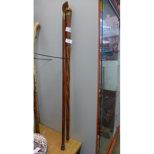 2195 - Two metal embellished walking sticks