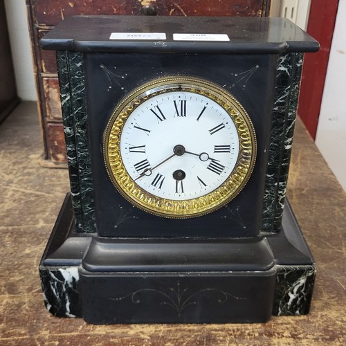 368 - A 19th Century French Belge noir mantel clock