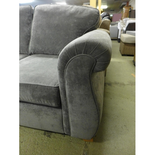 1997 - A grey upholstered two seater sofa - damaged leg