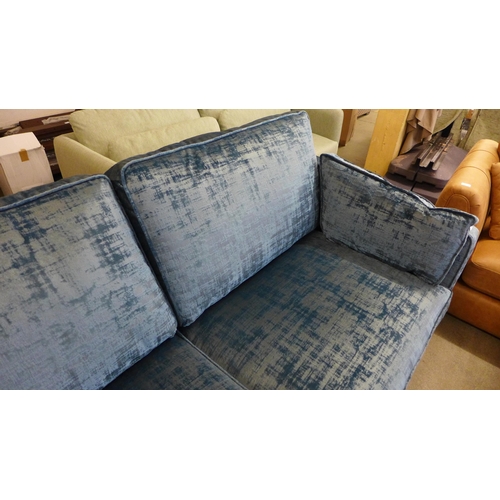 1301 - An ocean blue velvet Barker and Stonehouse three seater sofa