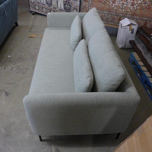 1310 - An olive upholstered three seater sofa