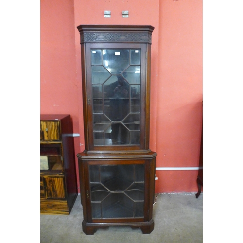 71 - An Edward VII Chippendale Revival mahogany freestanding corner cabinet