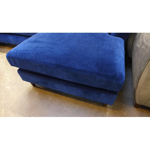 1354 - A blue velvet L shaped sofa with three contrasting scatter cushions