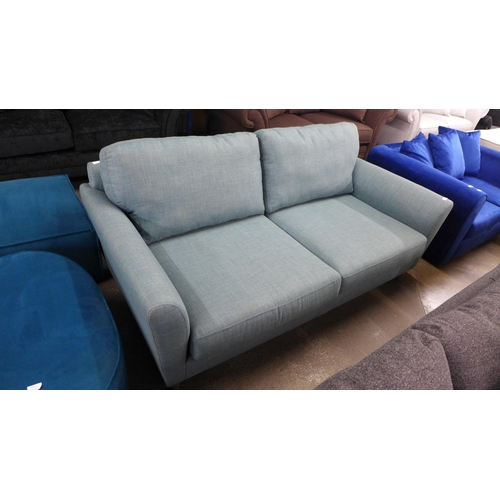 1371 - An aquamarine upholstered three seater sofa - RRP £1099