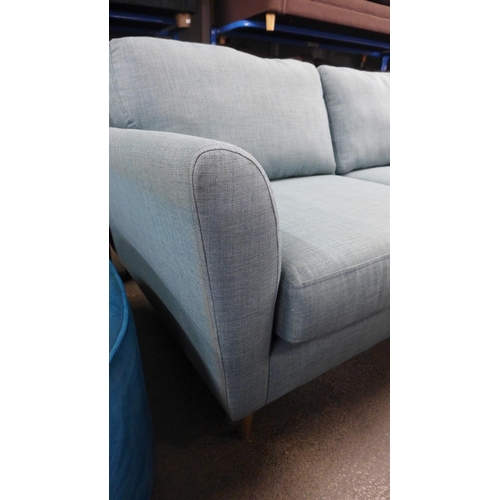 1371 - An aquamarine upholstered three seater sofa - RRP £1099