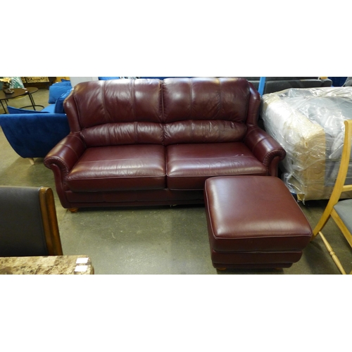 1382 - A Wade Upholstery burgundy leather high back four seater sofa with footstool