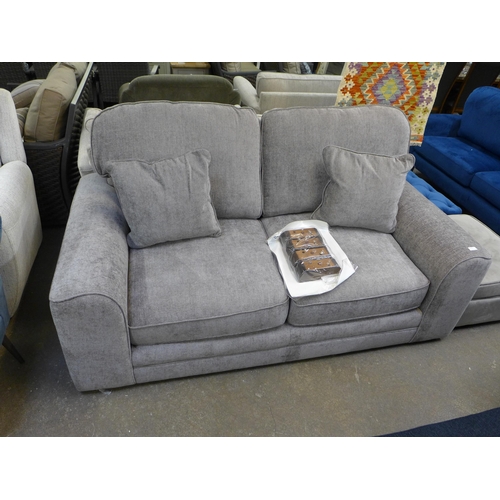 1384 - A mink upholstered three seater sofa