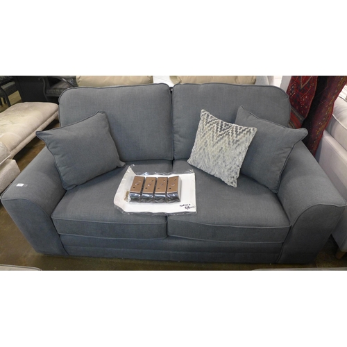 1385 - A grey upholstered three seater sofa