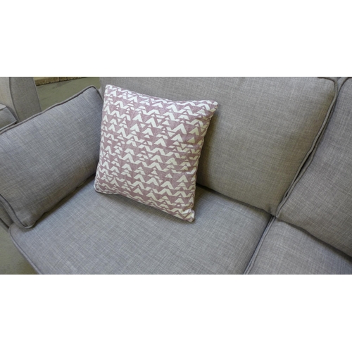 1420 - A light grey upholstered three seater sofa