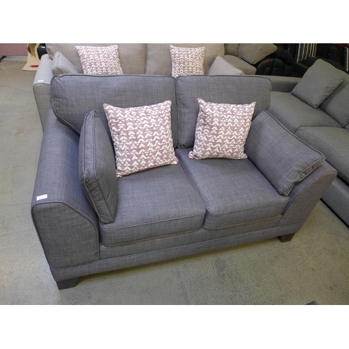 1421 - A dark grey upholstered two seater sofa