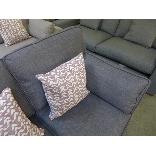 1421 - A dark grey upholstered two seater sofa