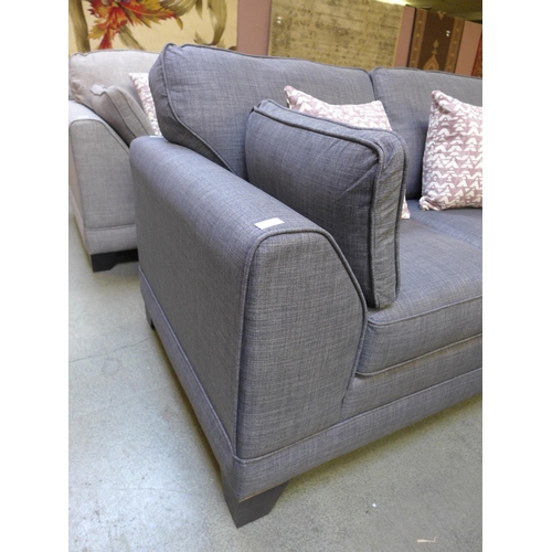 1421 - A dark grey upholstered two seater sofa