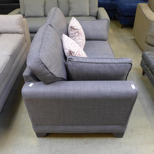 1421 - A dark grey upholstered two seater sofa