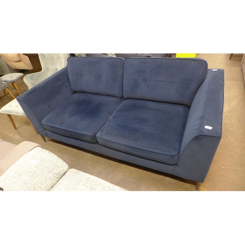 1446 - A deep ocean blue velvet, pinched back cushioned three seater sofa