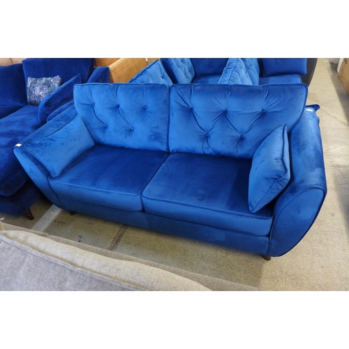 1453 - A Hoxton blue velvet three seater sofa