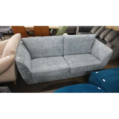 1492 - An aquamarine flecked three seater sofa - RRP £1099