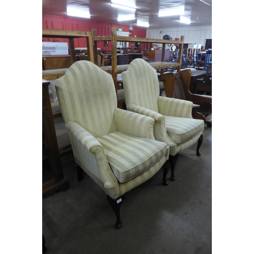 183 - A pair of Queen Anne style mahogany and fabric upholstered armchairs