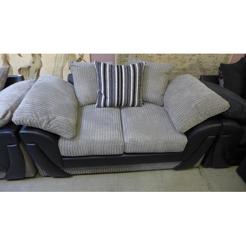 1549 - A grey and black jumbo cord pair of two seater sofas