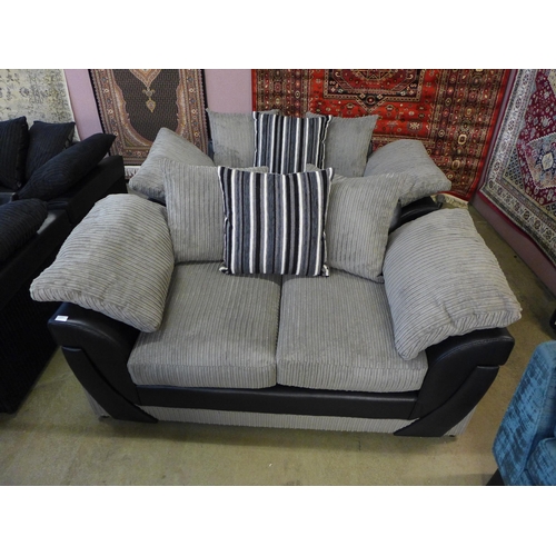 1550 - A mink and black jumbo cord pair of two seater sofas