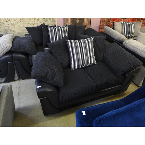 1551 - A pair of  black jumbo cord three and two seater sofas