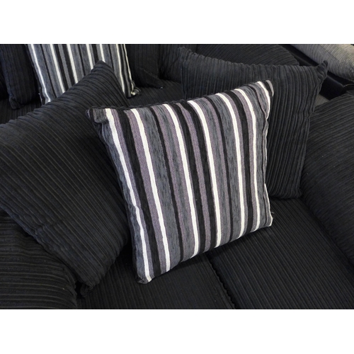 1551 - A pair of  black jumbo cord three and two seater sofas