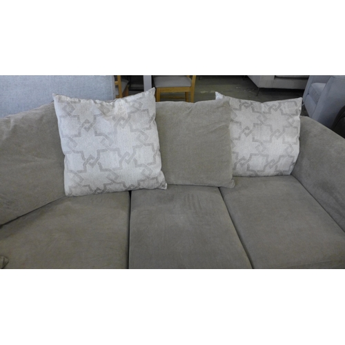 1588 - A sandstone upholstered corner sofa with patterned scatter back cushions