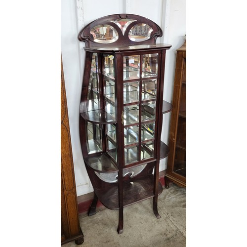 64B - A French Art Nouveau mahogany side cabinet