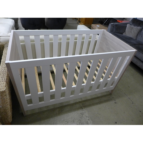 1600 - A wood effect and painted cot bed *this lot is subject to VAT