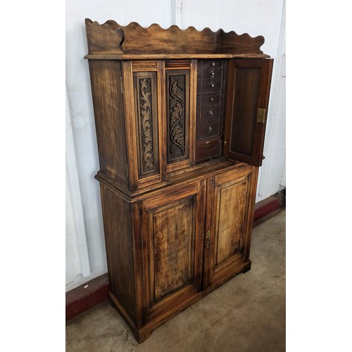 83E - A late 19th/early 20th Century French carved beech fitted six door cupboard