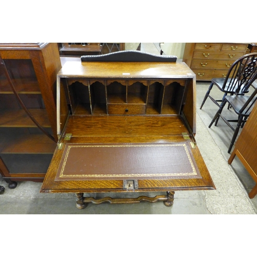 101 - An early 20th Century oak geometric moulded bureau