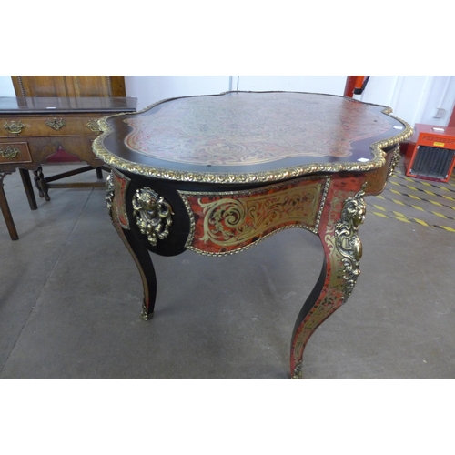 107A - A French Boulle style faux tortoiseshell, gilt metal and ebonised serpentine centre table