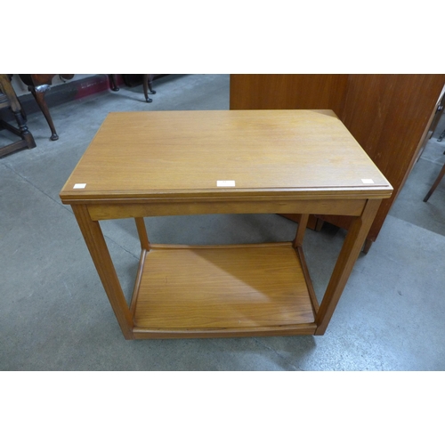 11 - A teak fold over trolley