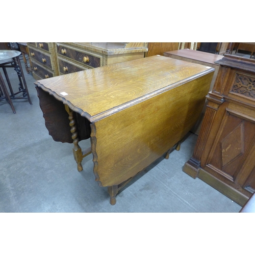 110 - An oak barleytwist gateleg table