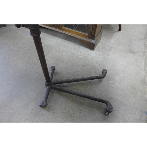 124 - A 19th Century adjustable cast iron and mahogany invalid table